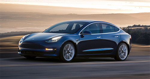 Tesla halves industry-leading warranty