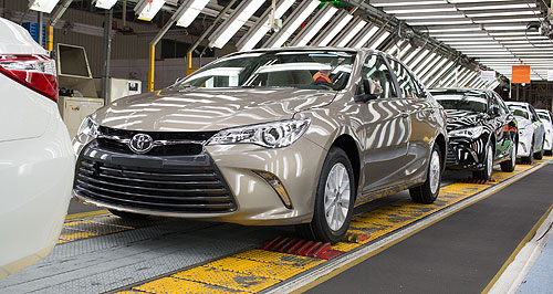 Toyota drives back into profit