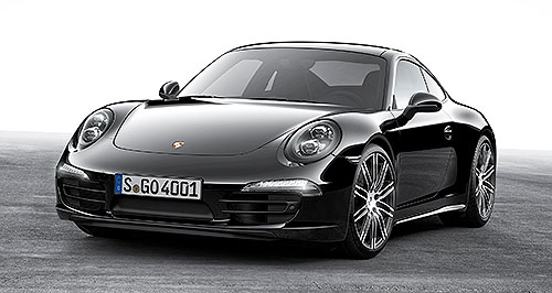 Porsche shows off Boxster, 911 dark side