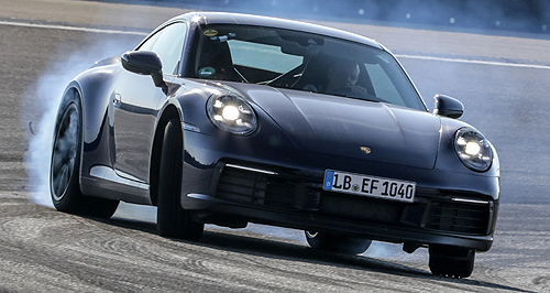 Porsche shows partially revealed 911 in testing photos